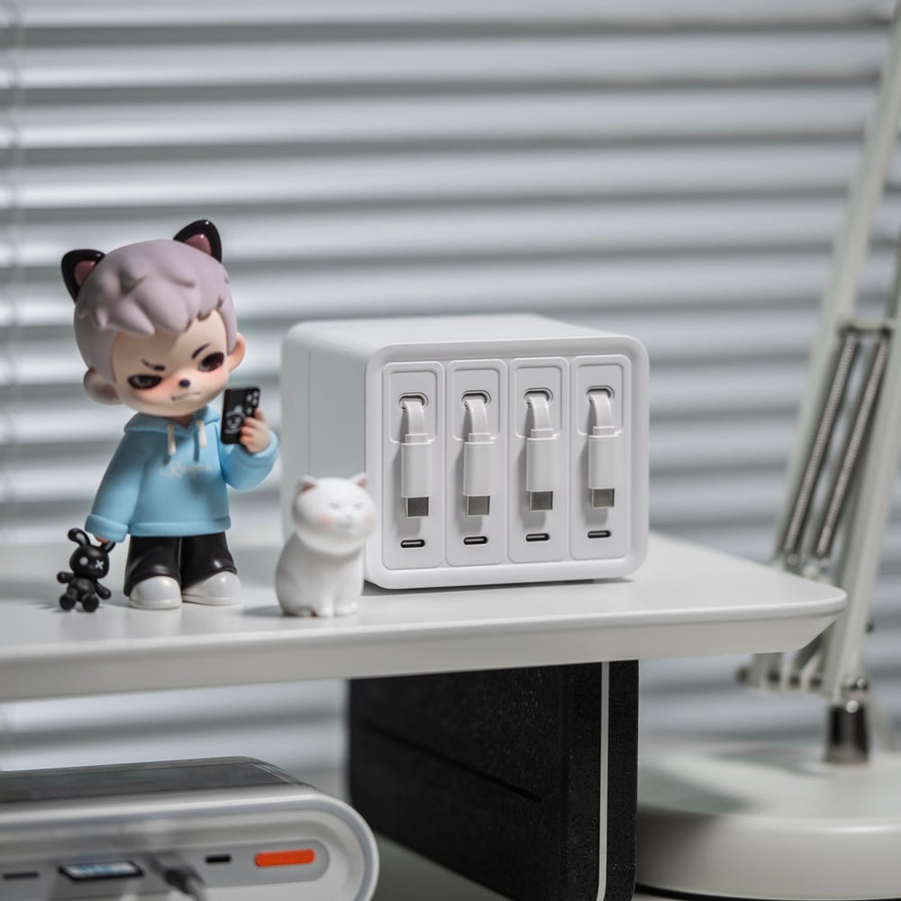 Compact white F63 on a white desk shelf